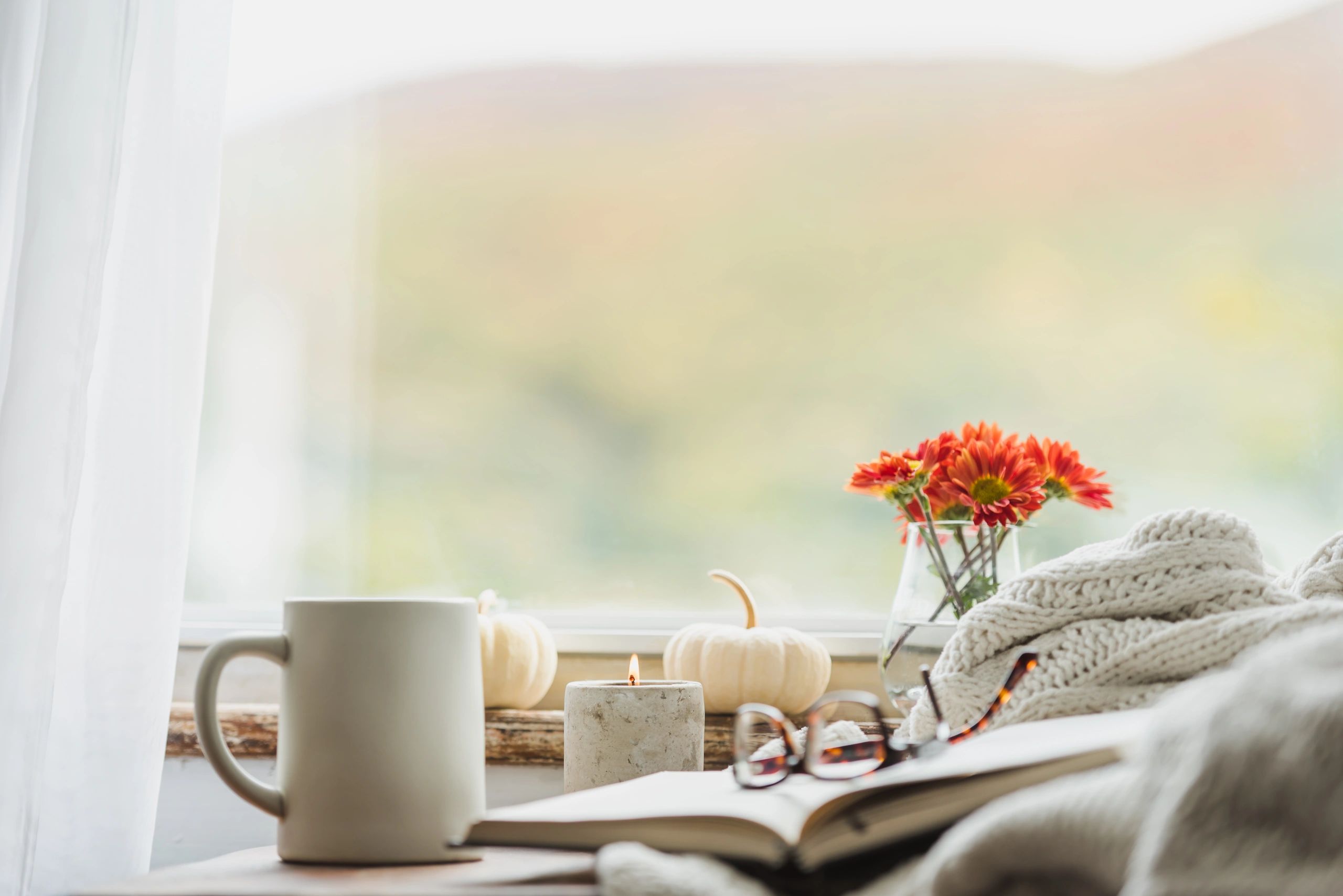 A cozy home setting with warm drinks and soft textures
