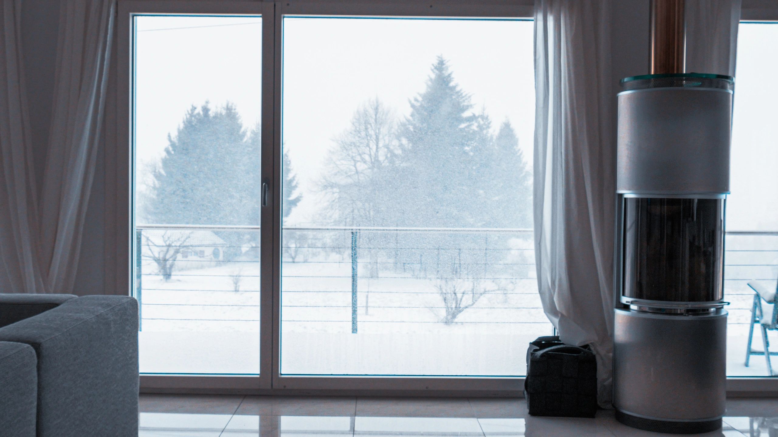 Cozy window-side nook with a winter view